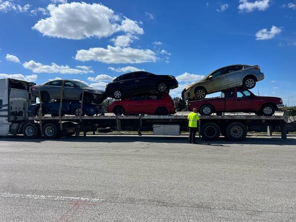 A car carrier hauling vehicles in Hialeah.