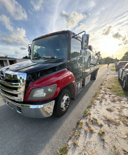 A rollback tow truck in Pembroke Pines.