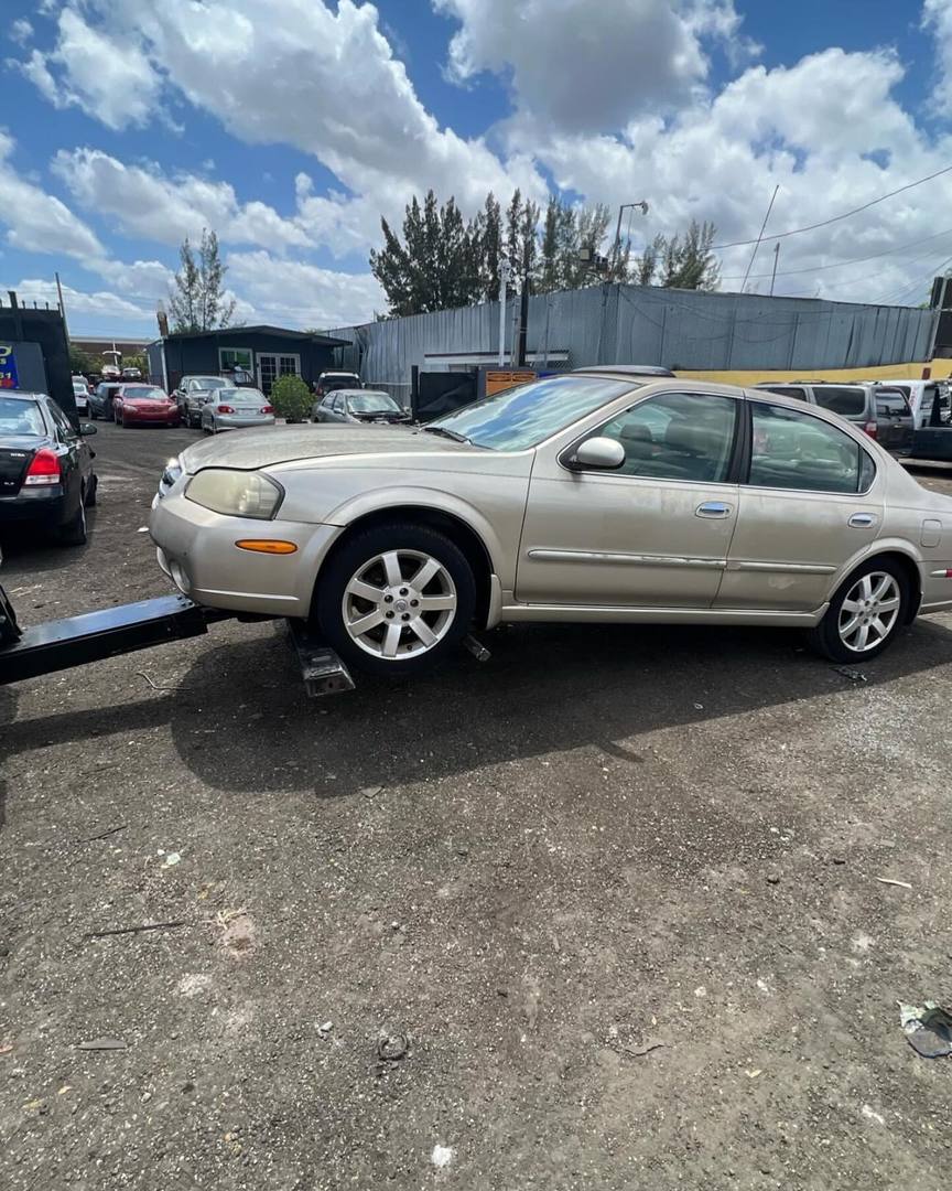 Junk car loaded for free towing in South Florida.